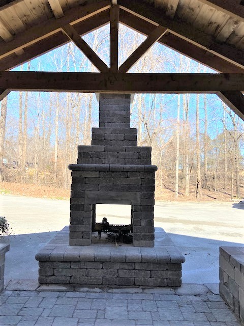 142 Lockmiller Road Winchester, TN 37398 - Photo 8 of 44 a living room with a fireplace and a floor to ceiling window