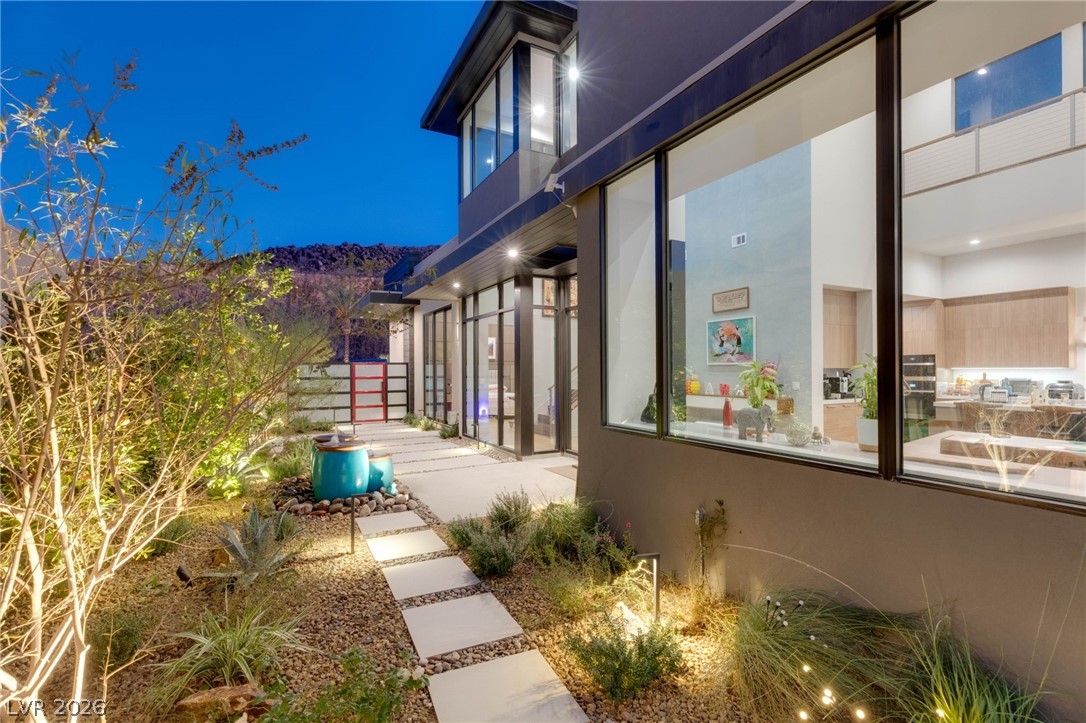 571 Overlook Rim Drive Henderson, NV 89012 - Photo 57 of 85 Property exterior at twilight featuring stucco siding