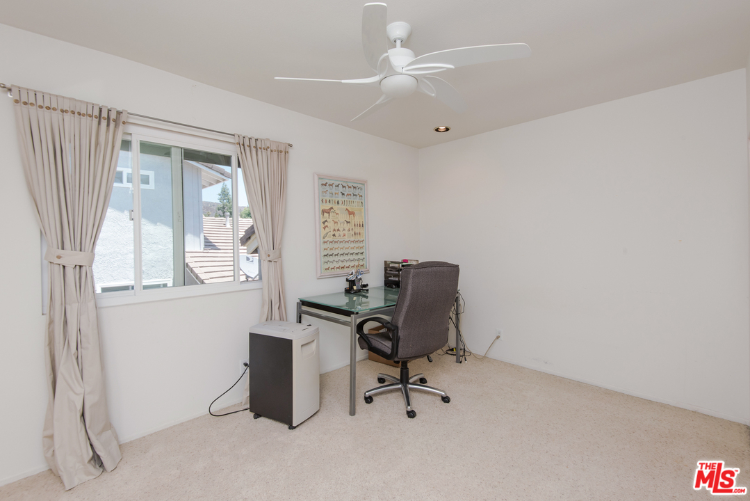 5533 Jon Dodson Drive Agoura Hills, CA 91301 - Photo 14 of 23 a view of a workspace with furniture and a window
