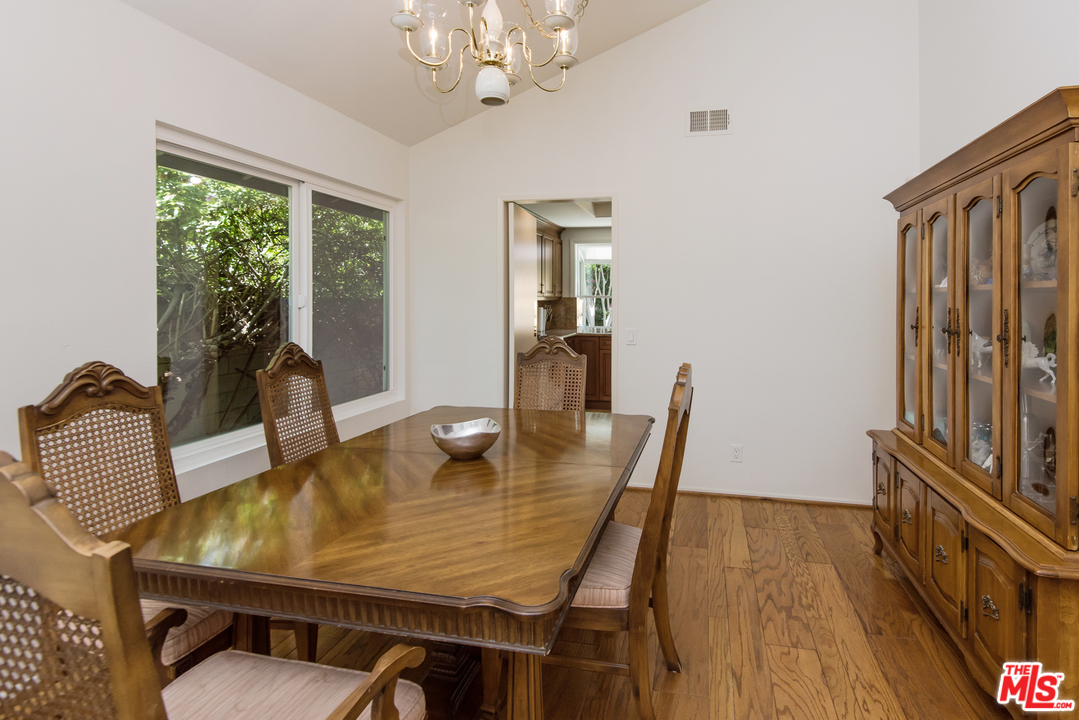 5533 Jon Dodson Drive Agoura Hills, CA 91301 - Photo 20 of 23 a dining room with furniture window and wooden floor
