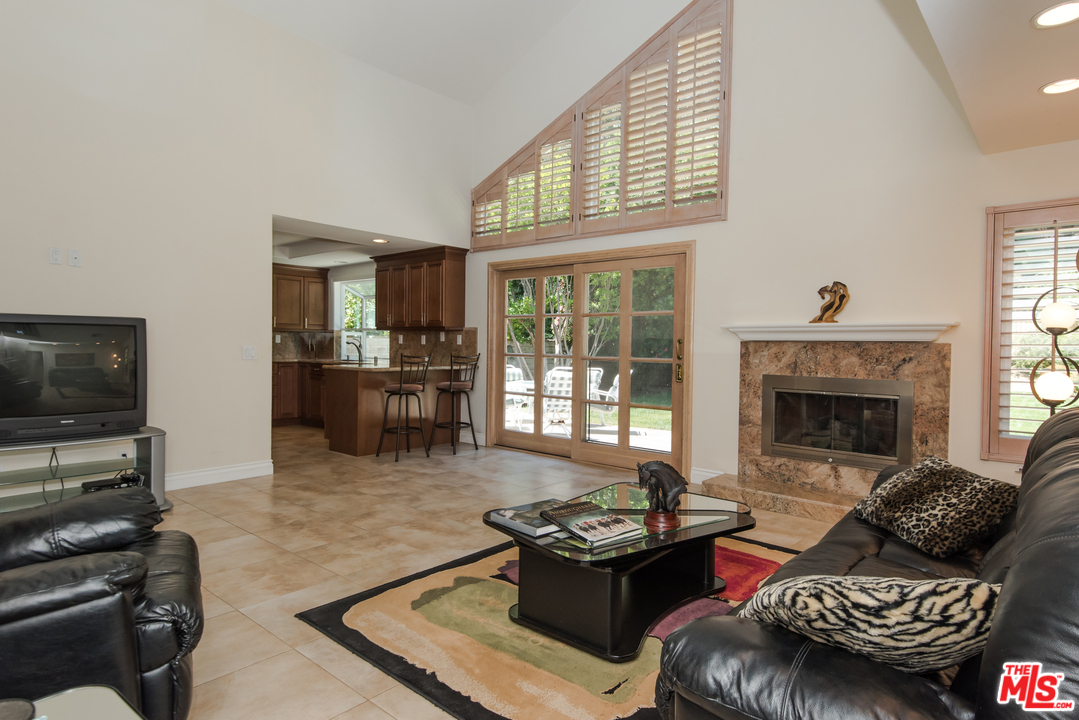 5533 Jon Dodson Drive Agoura Hills, CA 91301 - Photo 5 of 23 a living room with furniture and a fireplace