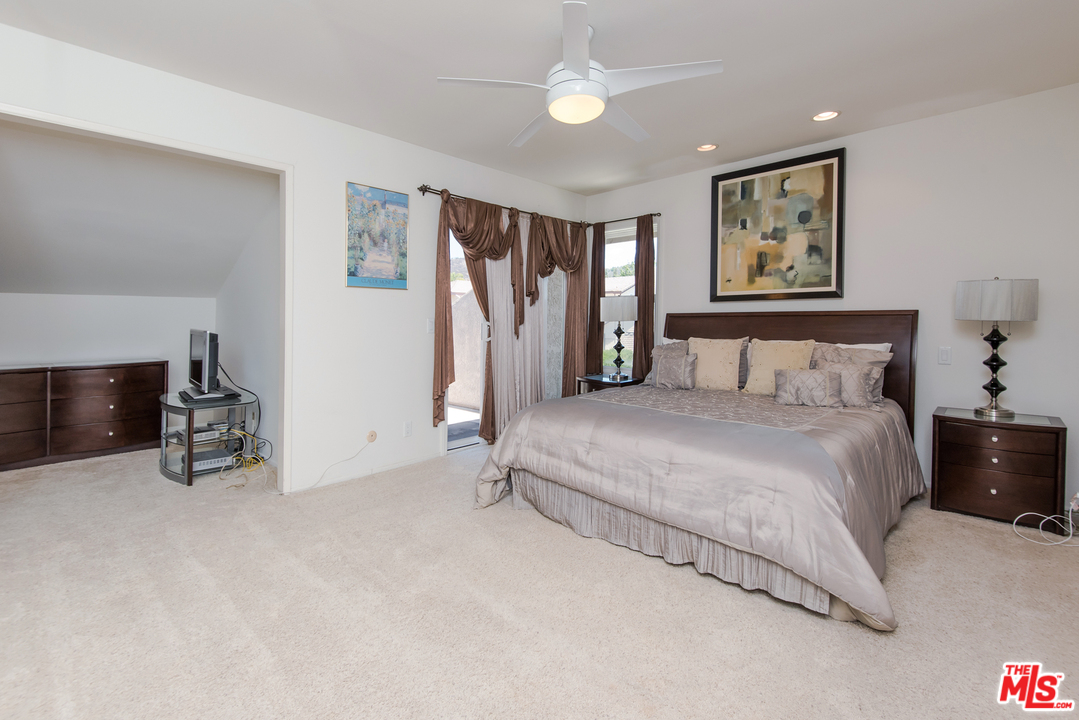 5533 Jon Dodson Drive Agoura Hills, CA 91301 - Photo 7 of 23 a spacious bedroom with a bed and a walk in closet