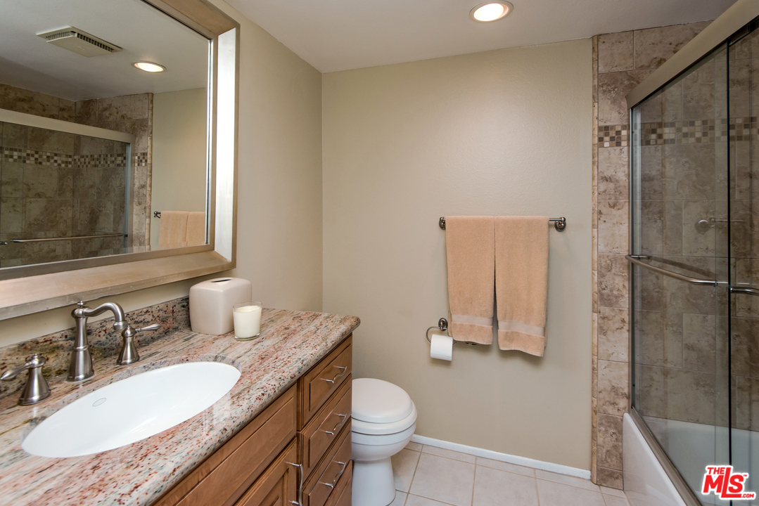 5533 Jon Dodson Drive Agoura Hills, CA 91301 - Photo 10 of 23 a bathroom with a granite countertop sink toilet and shower