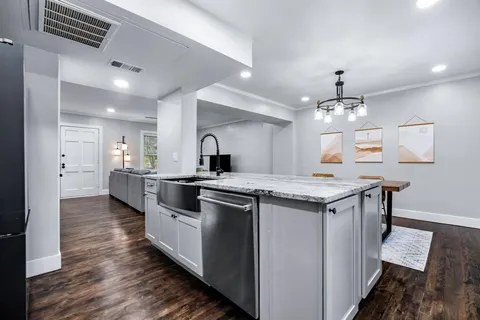 a kitchen with a stove and a sink