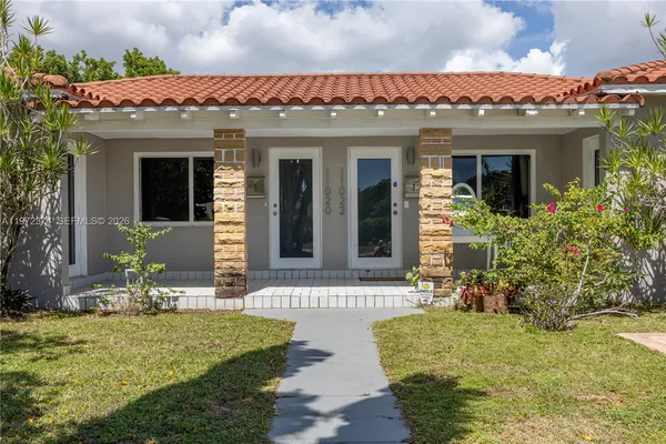 front view of a house with a yard
