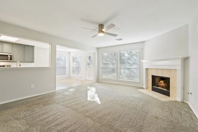 a view of an empty room with a fireplace