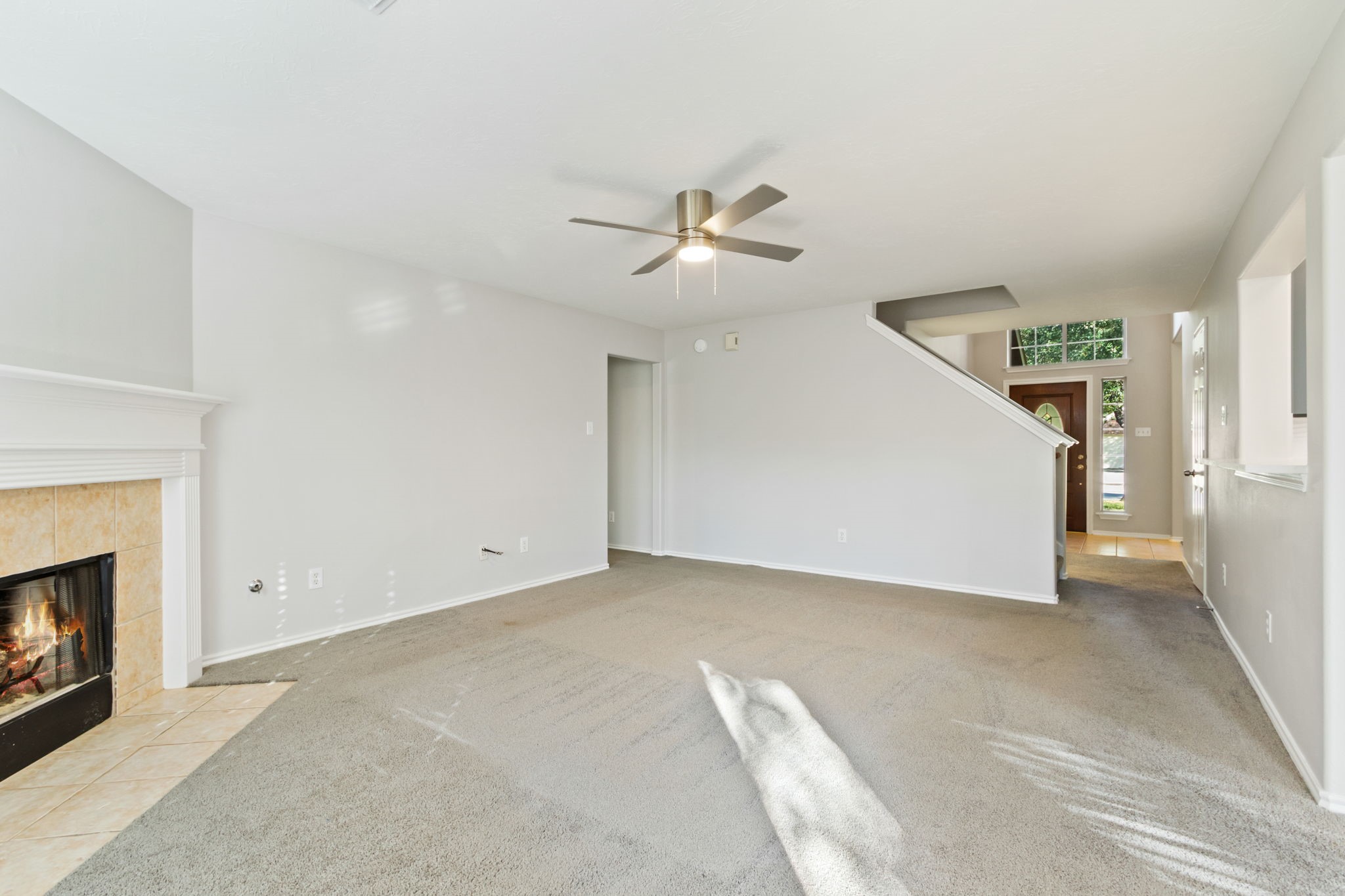 21035 Summer Trace Lane Spring, TX 77379 - Photo 13 of 50 a view of an empty room with a fireplace