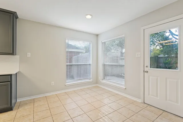 a view of a kitchen with a sink and a stove top oven