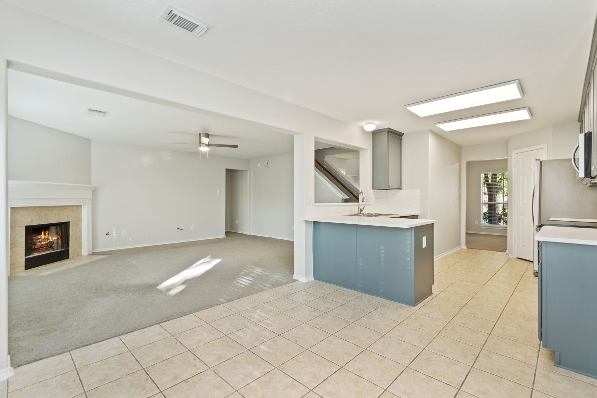 21035 Summer Trace Lane Spring, TX 77379 - Photo 18 of 50 a view of a kitchen with a sink and a stove top oven