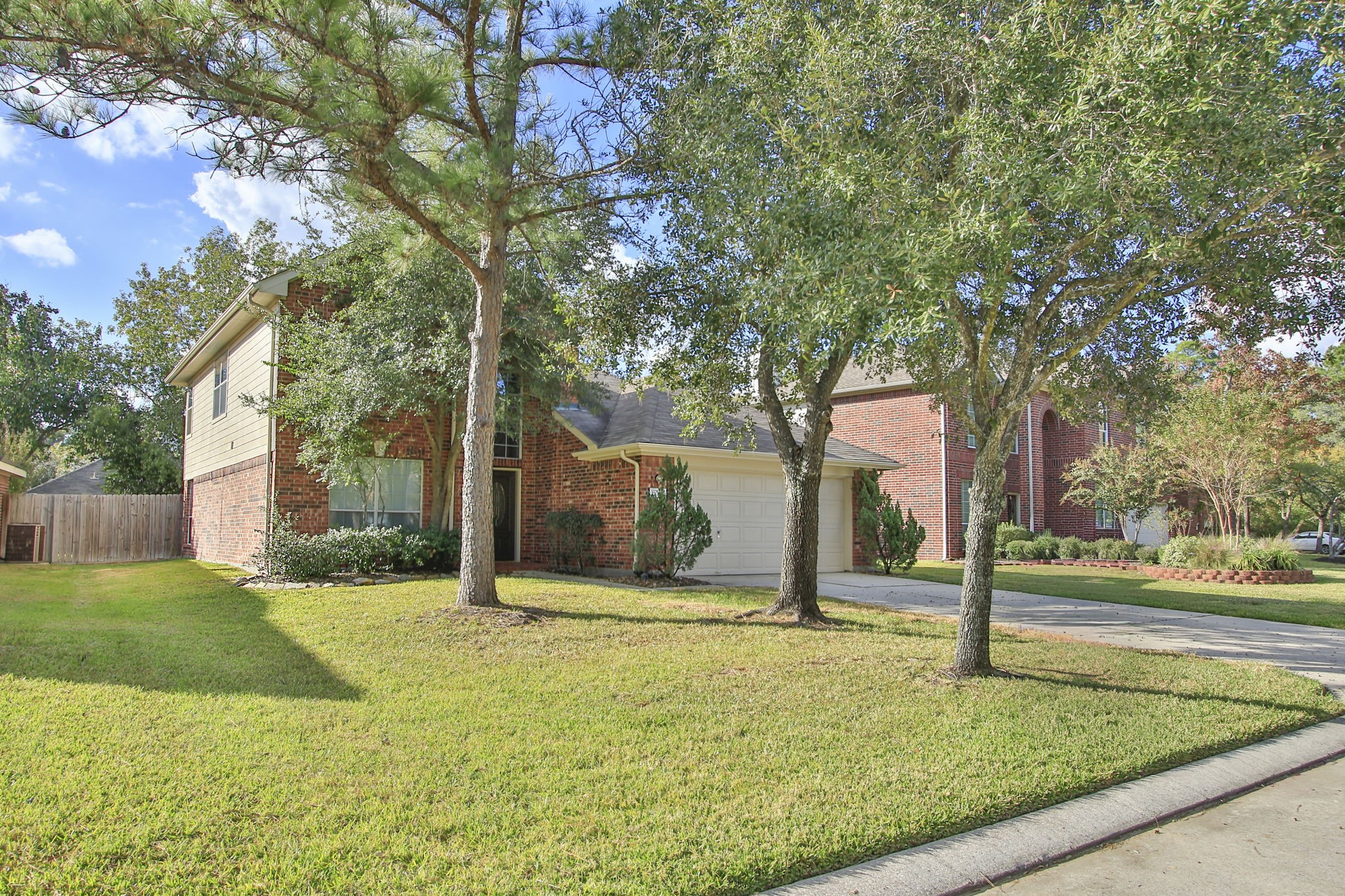 21035 Summer Trace Lane Spring, TX 77379 - Photo 2 of 50 a view of a house with backyard and tree