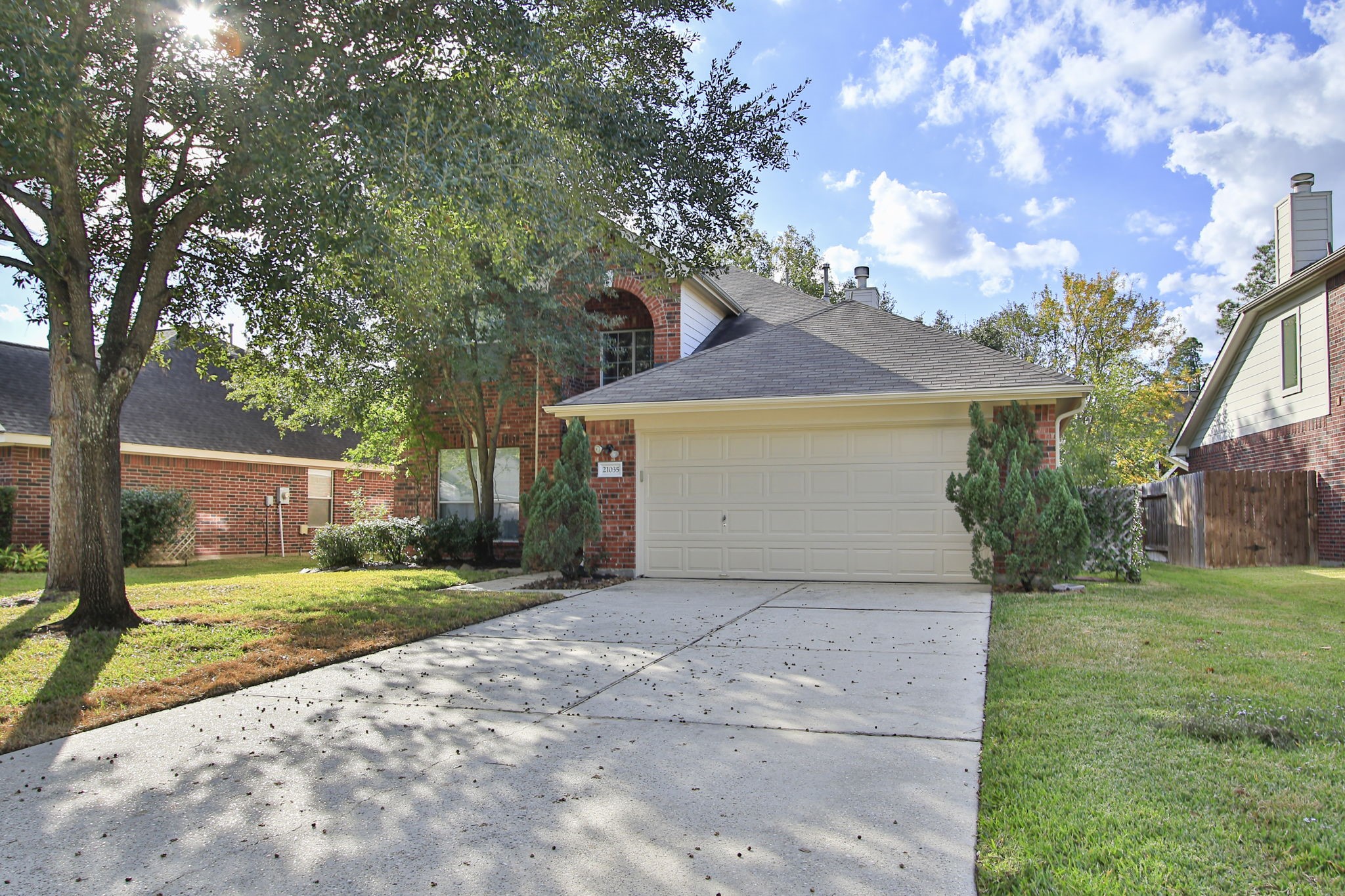 21035 Summer Trace Lane Spring, TX 77379 - Photo 3 of 50 a view of a house with a yard