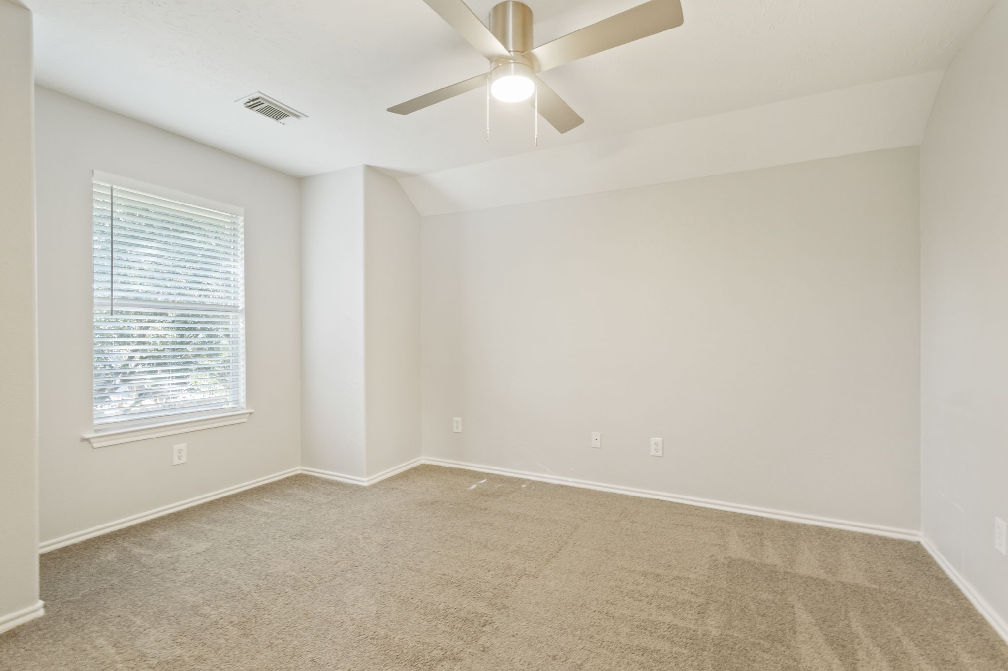 21035 Summer Trace Lane Spring, TX 77379 - Photo 32 of 50 an empty room with a window and a fan