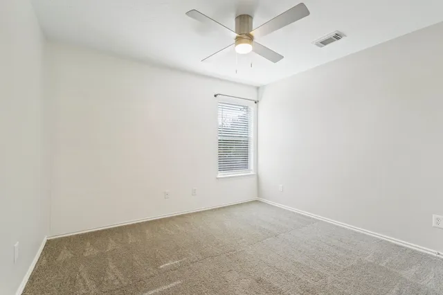 a view of a house with yard and tree s