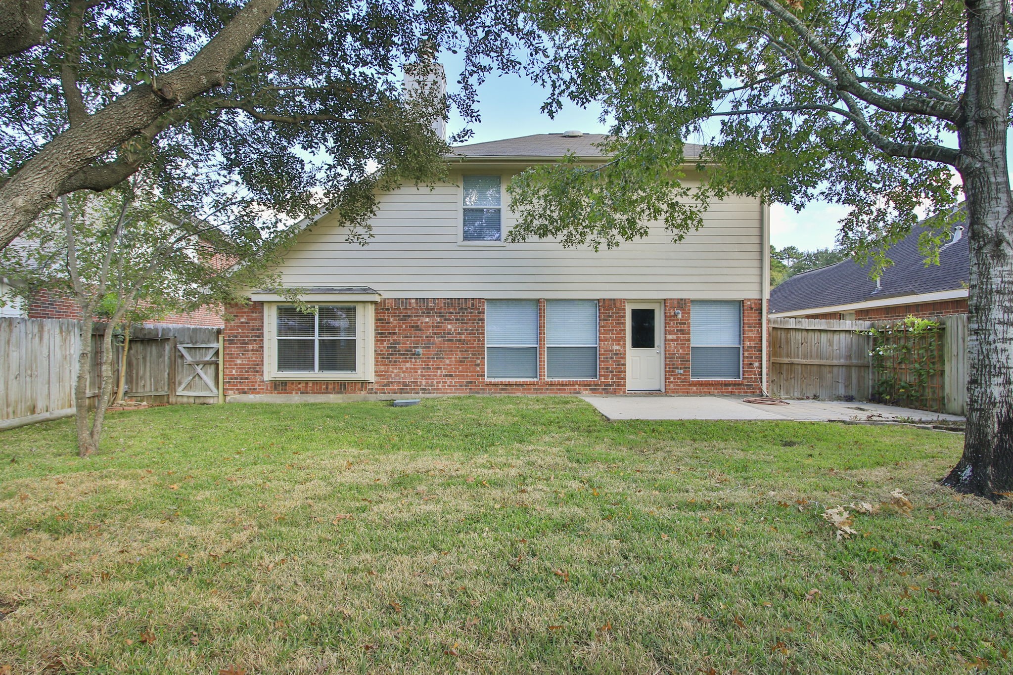 21035 Summer Trace Lane Spring, TX 77379 - Photo 38 of 50 a view of a house with a backyard