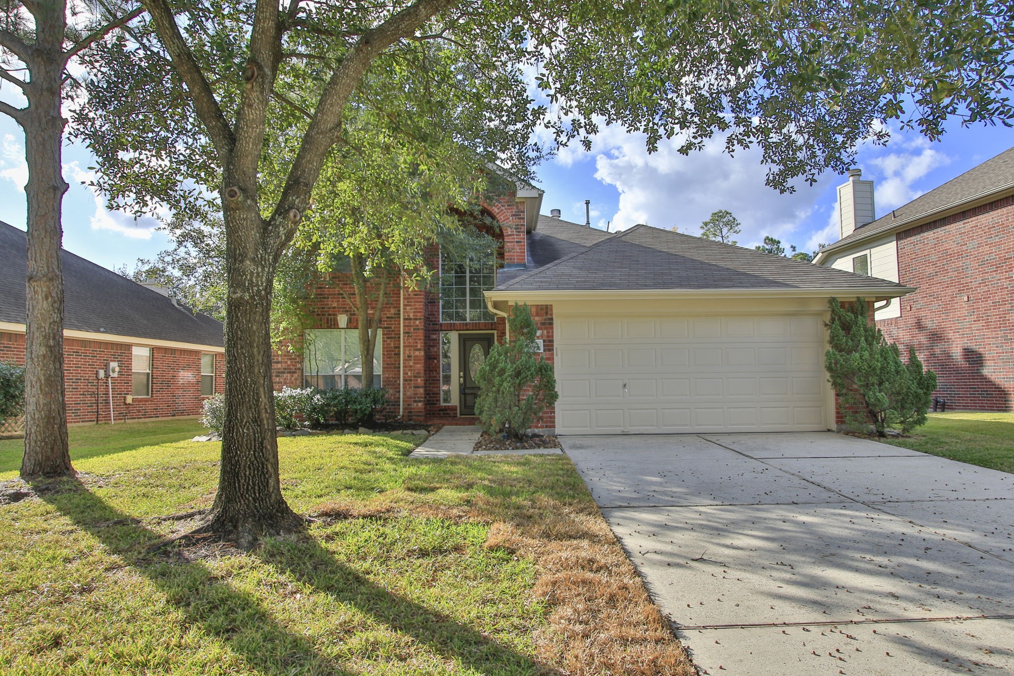 21035 Summer Trace Lane Spring, TX 77379 - Photo 4 of 50 a view of a house with a yard
