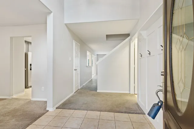 a view of a entryway door with wooden floor