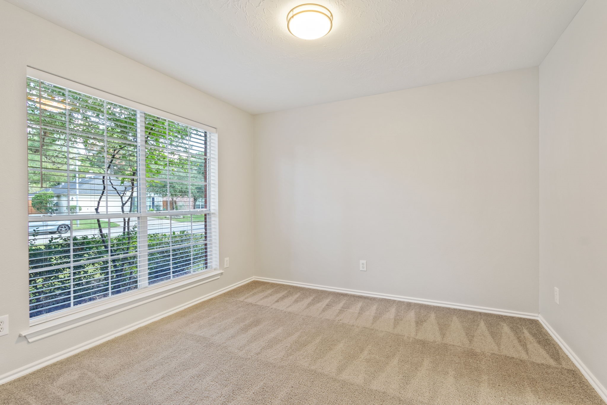 21035 Summer Trace Lane Spring, TX 77379 - Photo 9 of 50 a view of an empty room with a window