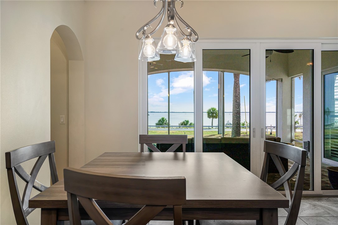 7635 Agawam Road Micco, FL 32976 - Photo 12 of 36 a view of a dining room with furniture window and outside view