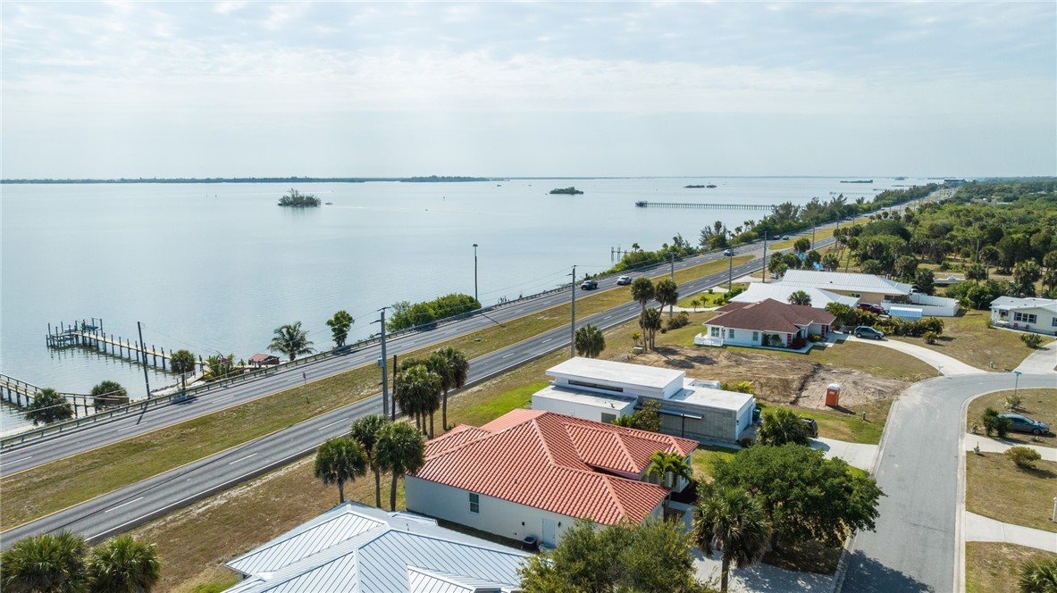 7635 Agawam Road Micco, FL 32976 - Photo 2 of 36 a view of houses with an outdoor space