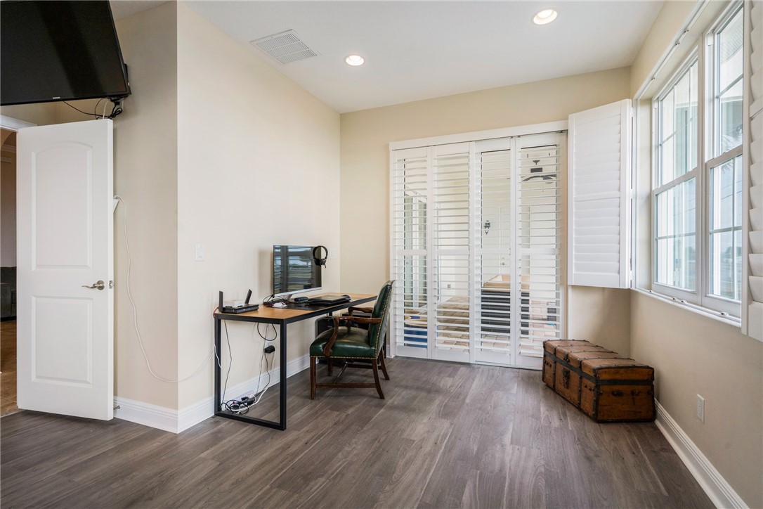 7635 Agawam Road Micco, FL 32976 - Photo 21 of 36 a view of a workspace with furniture and a window