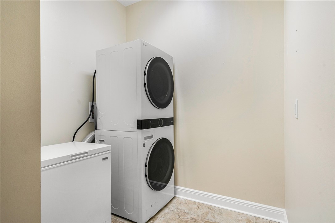 7635 Agawam Road Micco, FL 32976 - Photo 29 of 36 a utility room with dryer and washer