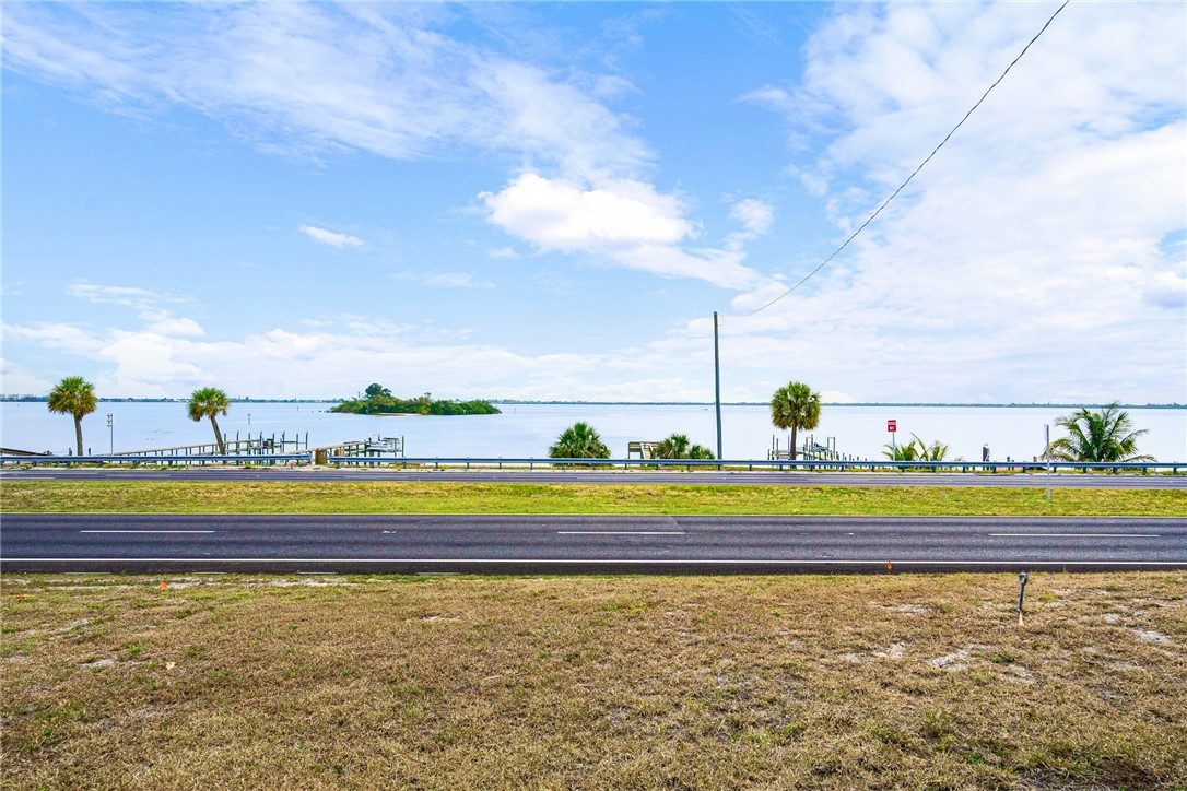 7635 Agawam Road Micco, FL 32976 - Photo 32 of 36 a view of an empty room with a lake view and beach