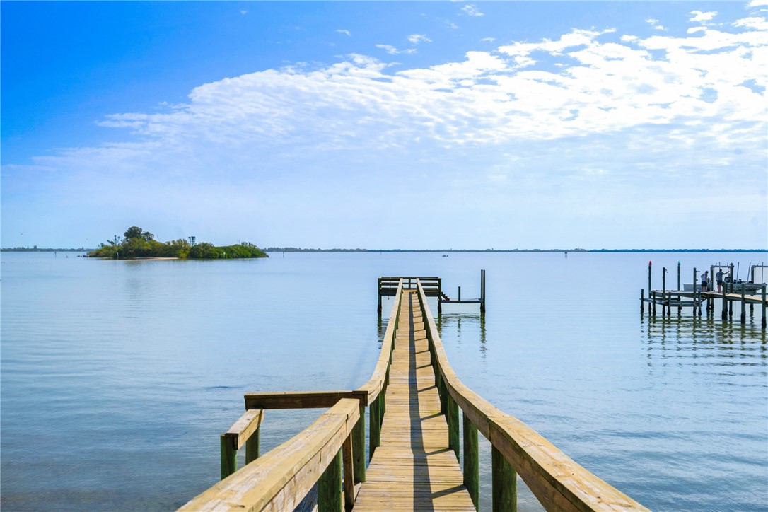 7635 Agawam Road Micco, FL 32976 - Photo 33 of 36 a view of a balcony with wooden floor and fence
