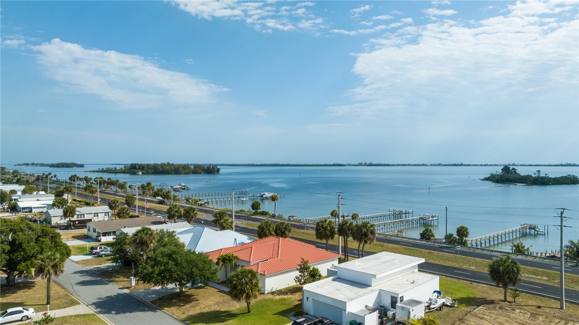 7635 Agawam Road Micco, FL 32976 - Photo 35 of 36 an aerial view of a houses with outdoor space