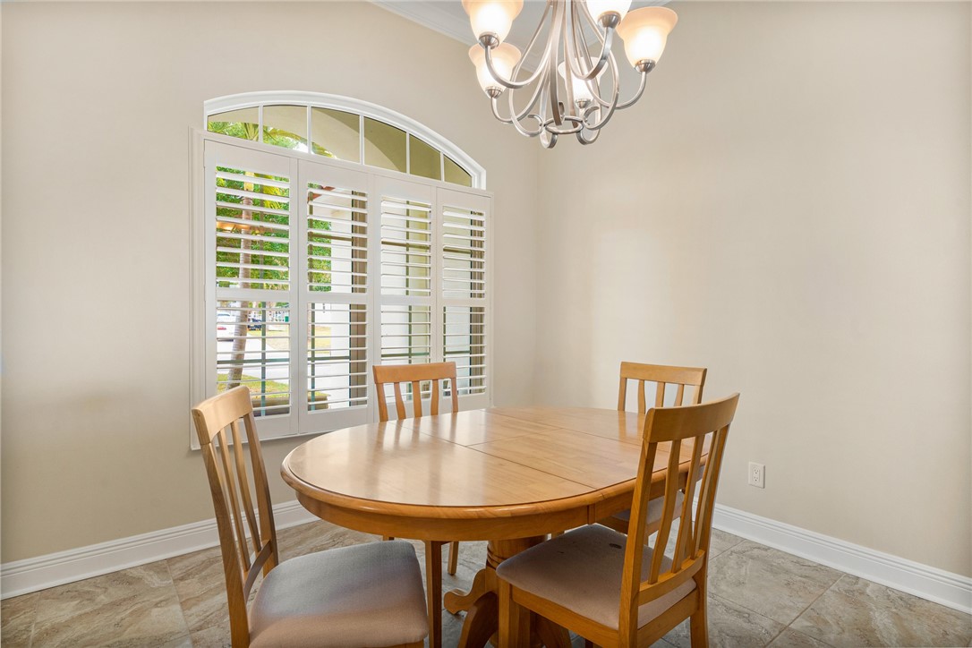7635 Agawam Road Micco, FL 32976 - Photo 4 of 36 a view of a dining room with furniture window and outside view