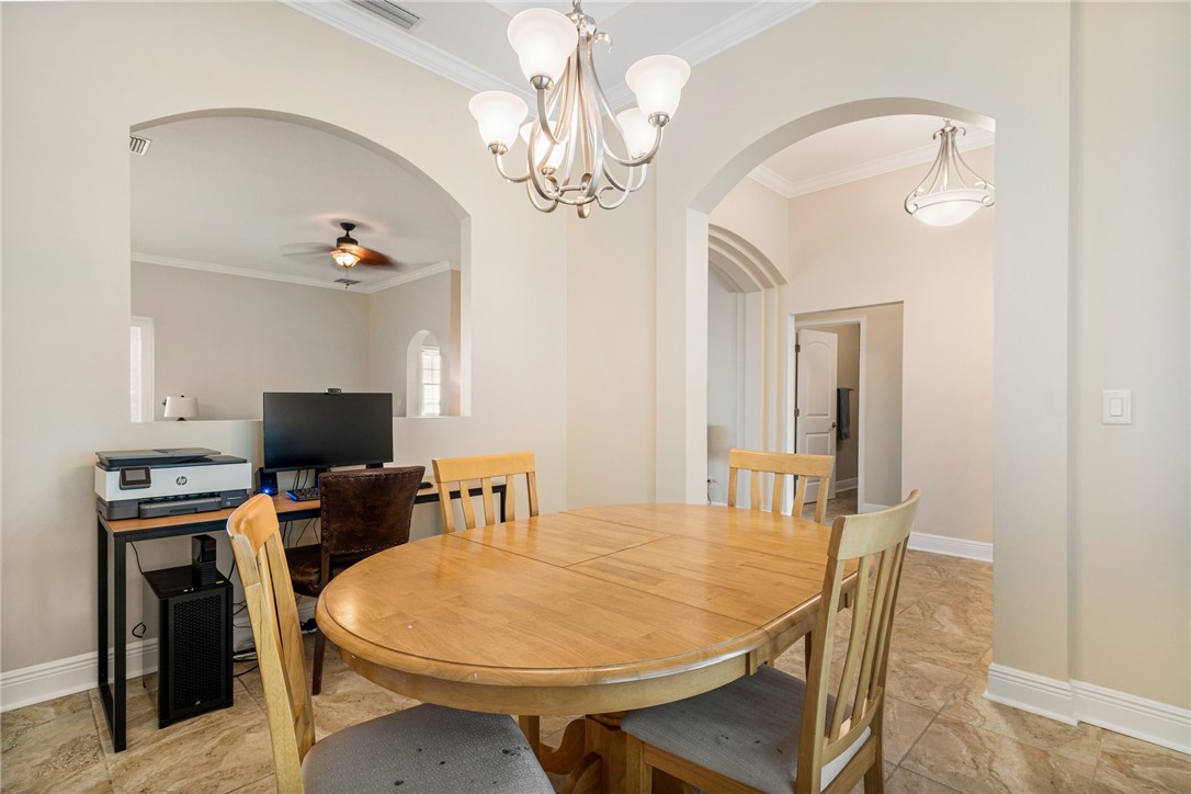 7635 Agawam Road Micco, FL 32976 - Photo 5 of 36 a view of a dining room with furniture and wooden floor