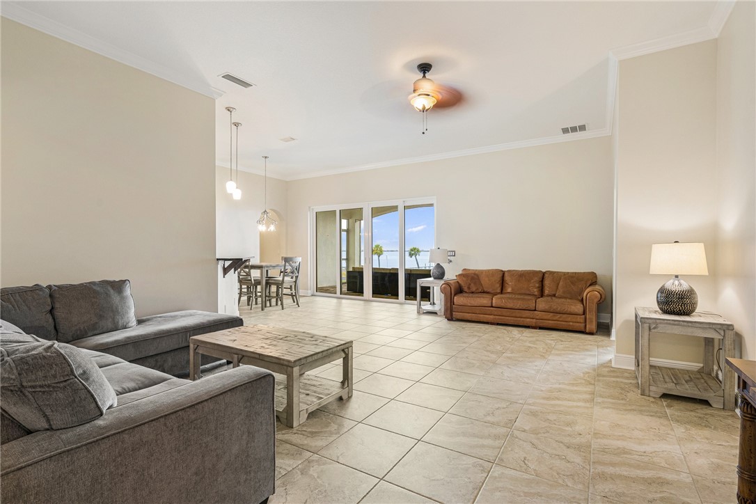 7635 Agawam Road Micco, FL 32976 - Photo 6 of 36 a living room with furniture and a table