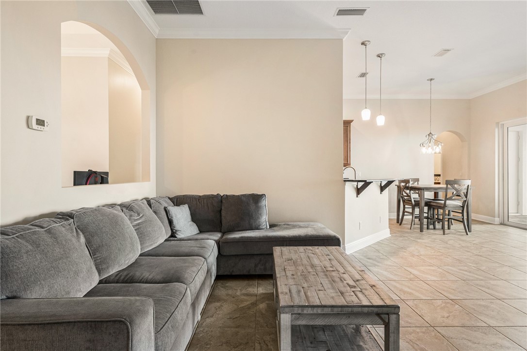 7635 Agawam Road Micco, FL 32976 - Photo 7 of 36 a living room with furniture and kitchen view