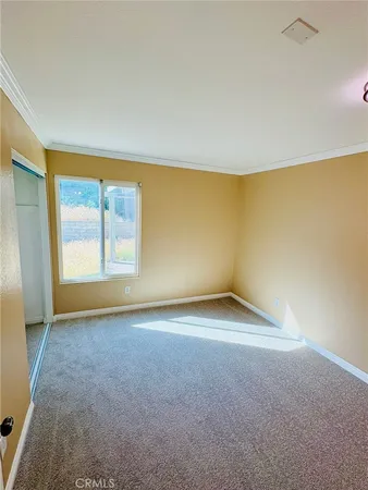 an empty room with a empty space and a window
