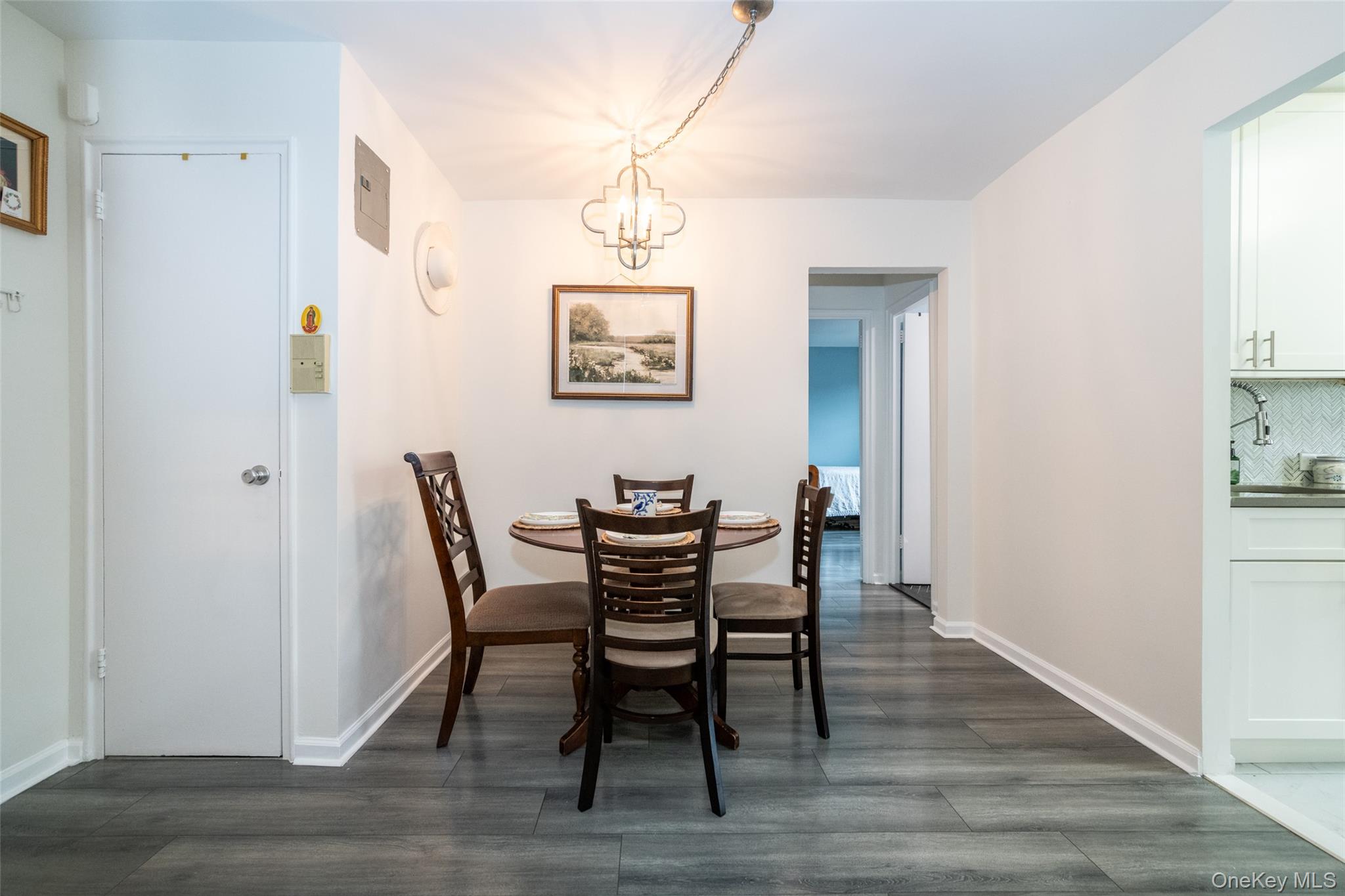 450 Pelham Road, Unit 3H New Rochelle, NY 10805 - Photo 4 of 16 a view of a dining room with furniture and wooden floor