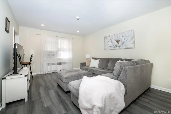 a spacious bedroom with a bed and a couch