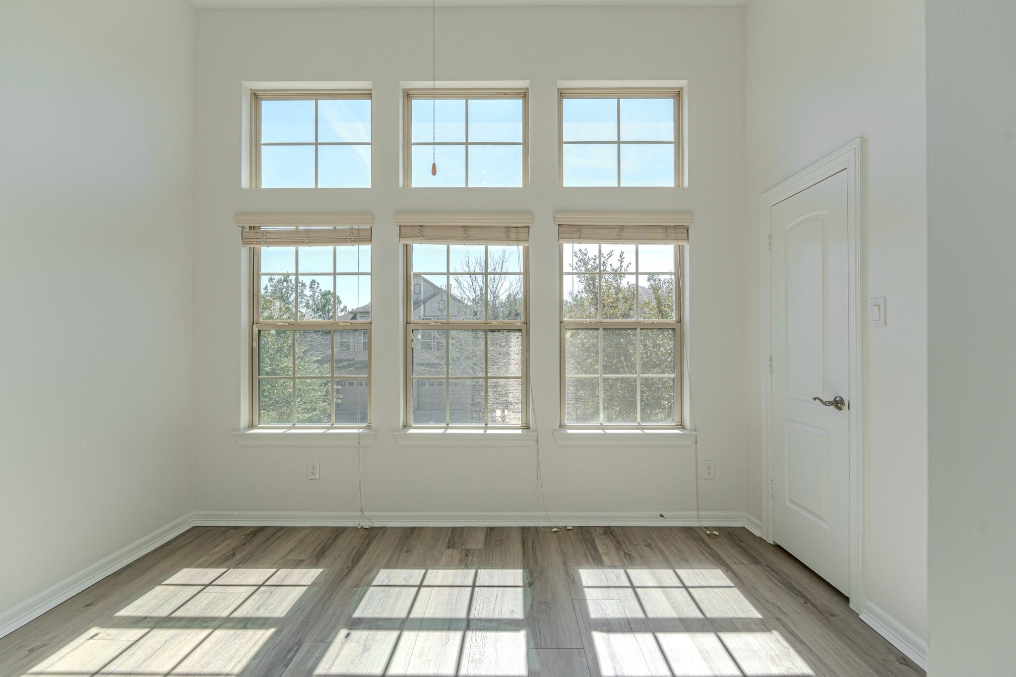 58 Aventura Place Spring, TX 77389 - Photo 20 of 23 a view of an empty room and a window