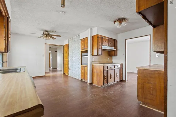 a view of an entryway with kitchen