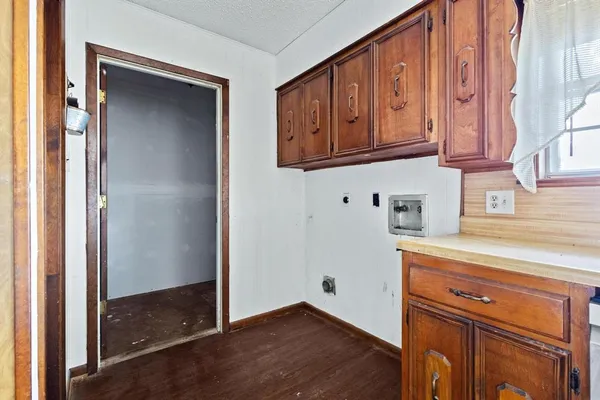 a view of cabinets and wooden floor