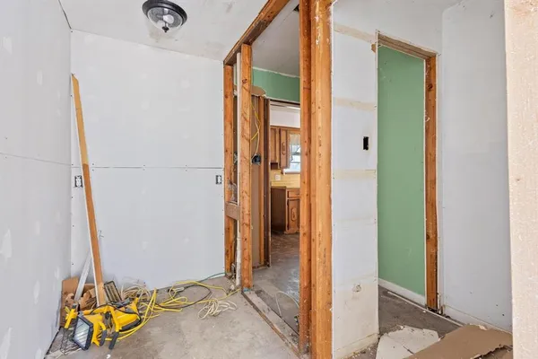 a view of an entryway with wooden floor