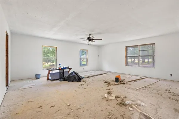 a view of a livingroom with furniture and windows