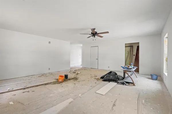 a room with a bed and white cabinet