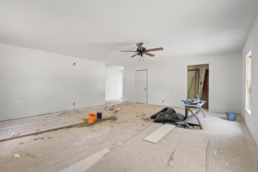 5994 Fm 1753 Denison, TX 75021 - Photo 20 of 34 a room with a bed and white cabinet