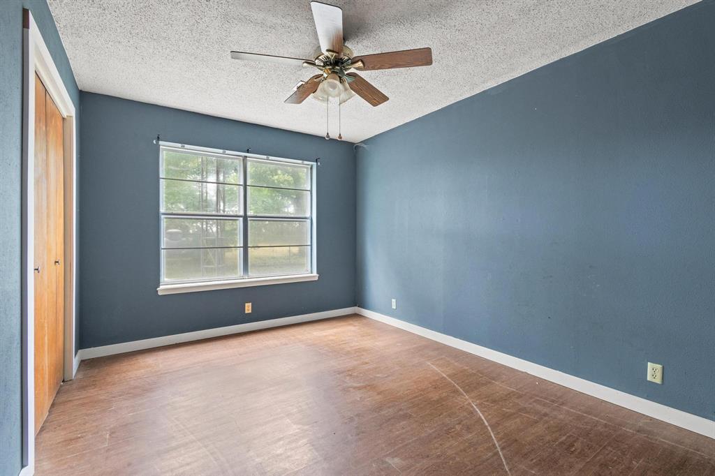 5994 Fm 1753 Denison, TX 75021 - Photo 23 of 34 an empty room with a window and a fan