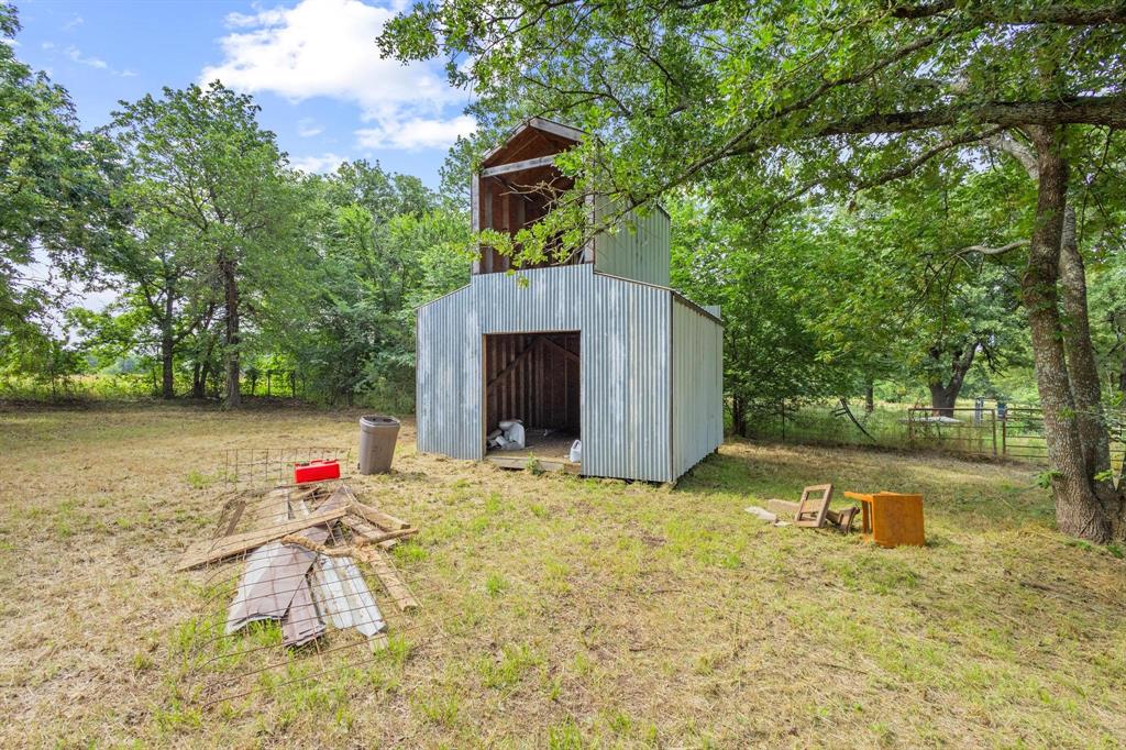 5994 Fm 1753 Denison, TX 75021 - Photo 33 of 34 a backyard of a house with swimming pool and trees