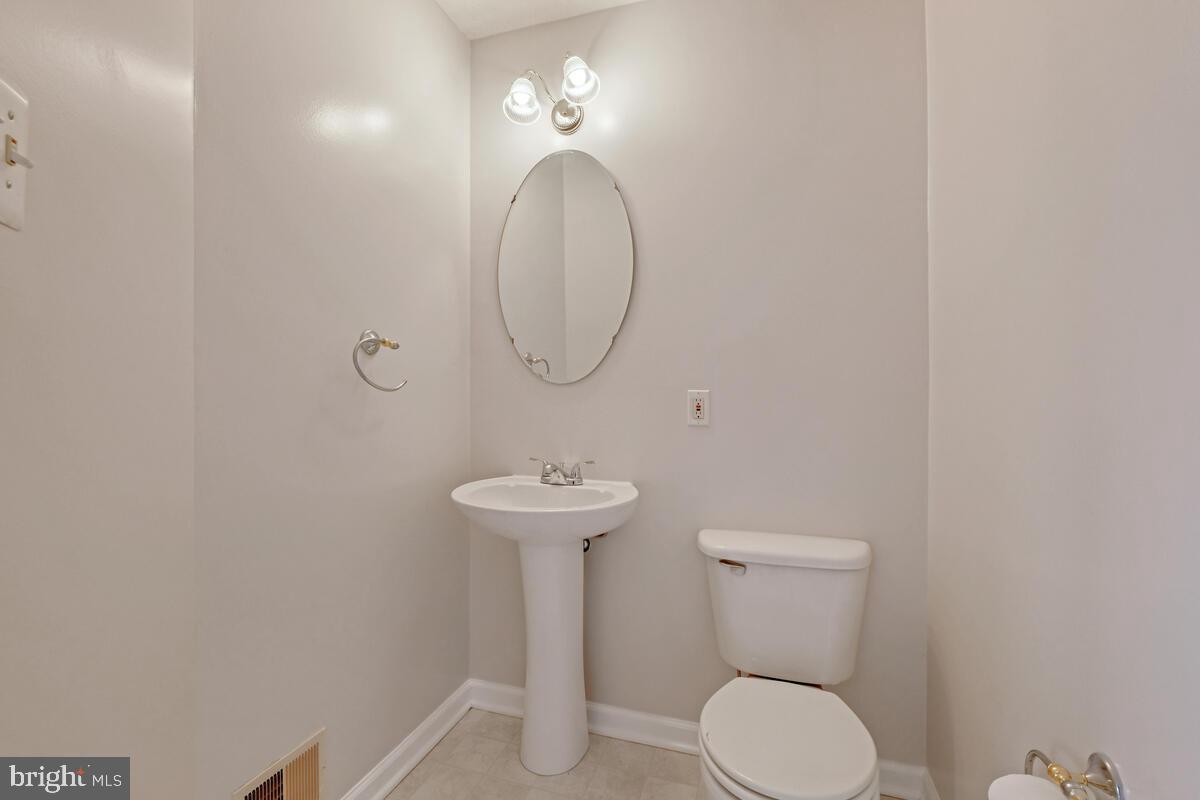 5032 Finsbury Road Rosedale, MD 21237 - Photo 18 of 40 Main Level Powder Room