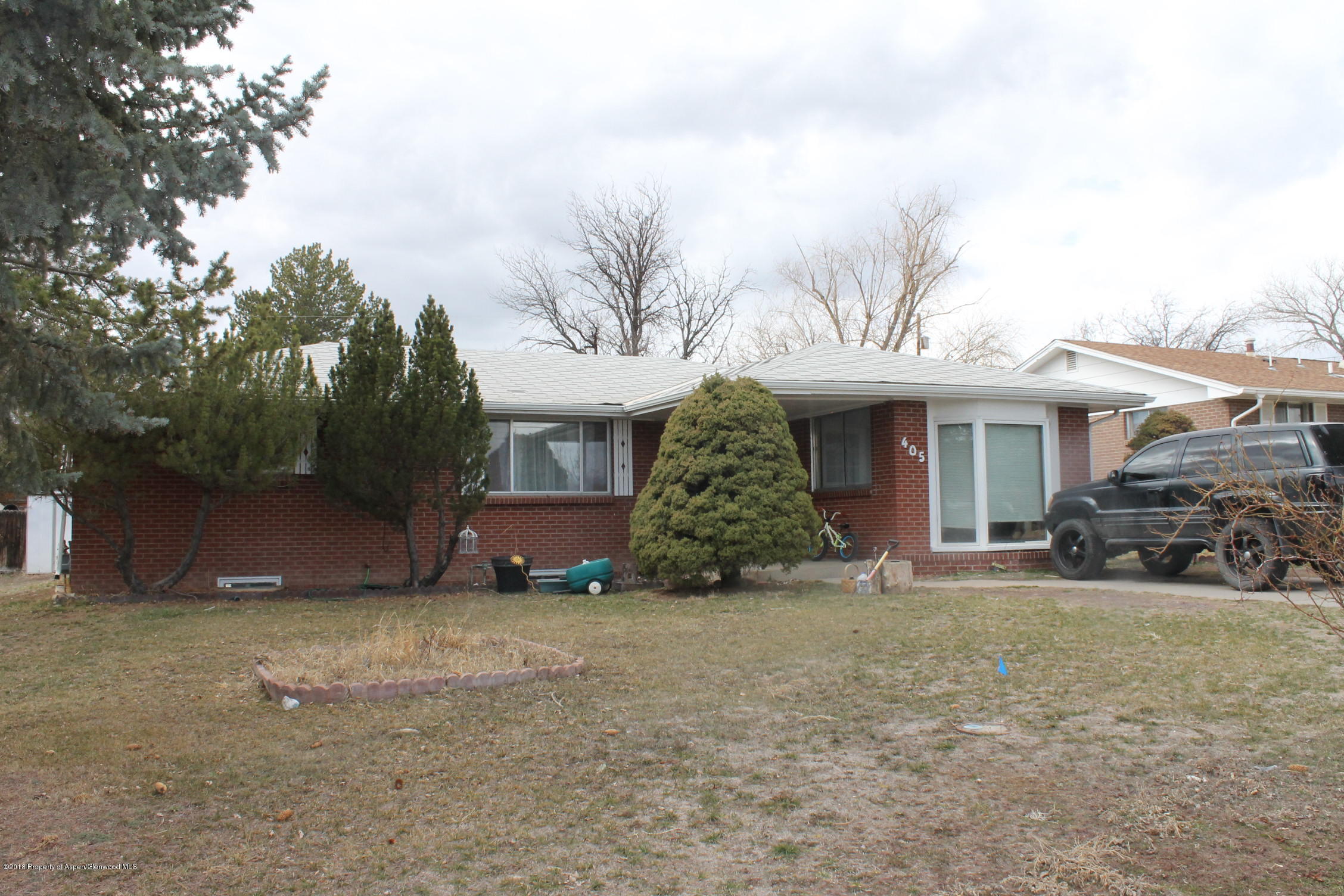 405 Ute Avenue Rifle, CO 81650 - Photo 1 of 21 a view of a house with a yard and garage