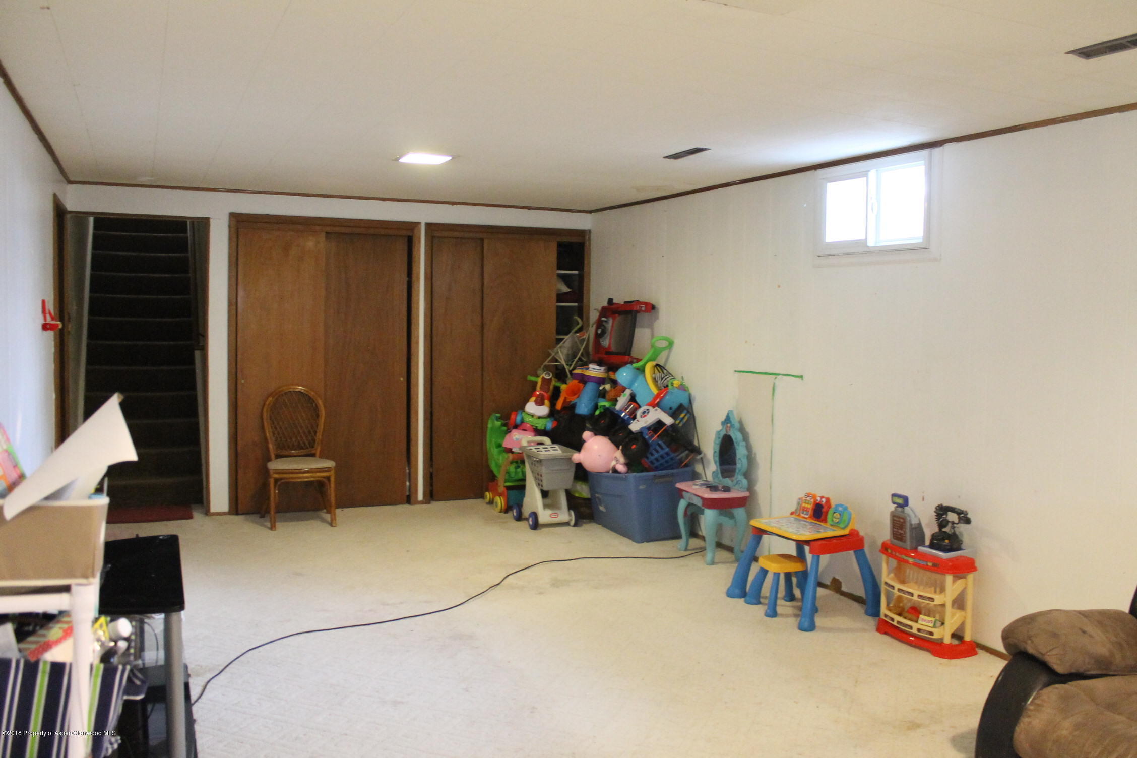 405 Ute Avenue Rifle, CO 81650 - Photo 17 of 21 a bedroom with furniture and a fan
