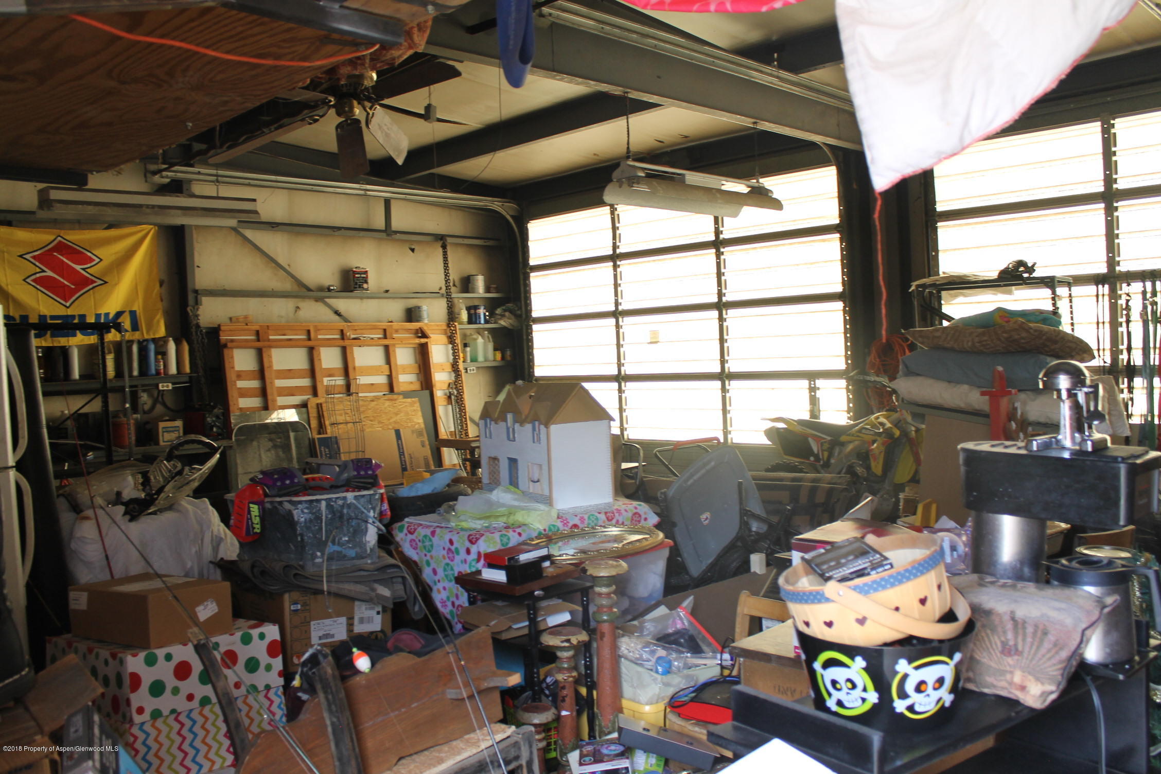 405 Ute Avenue Rifle, CO 81650 - Photo 19 of 21 a living room filled with furniture and a floor to ceiling window