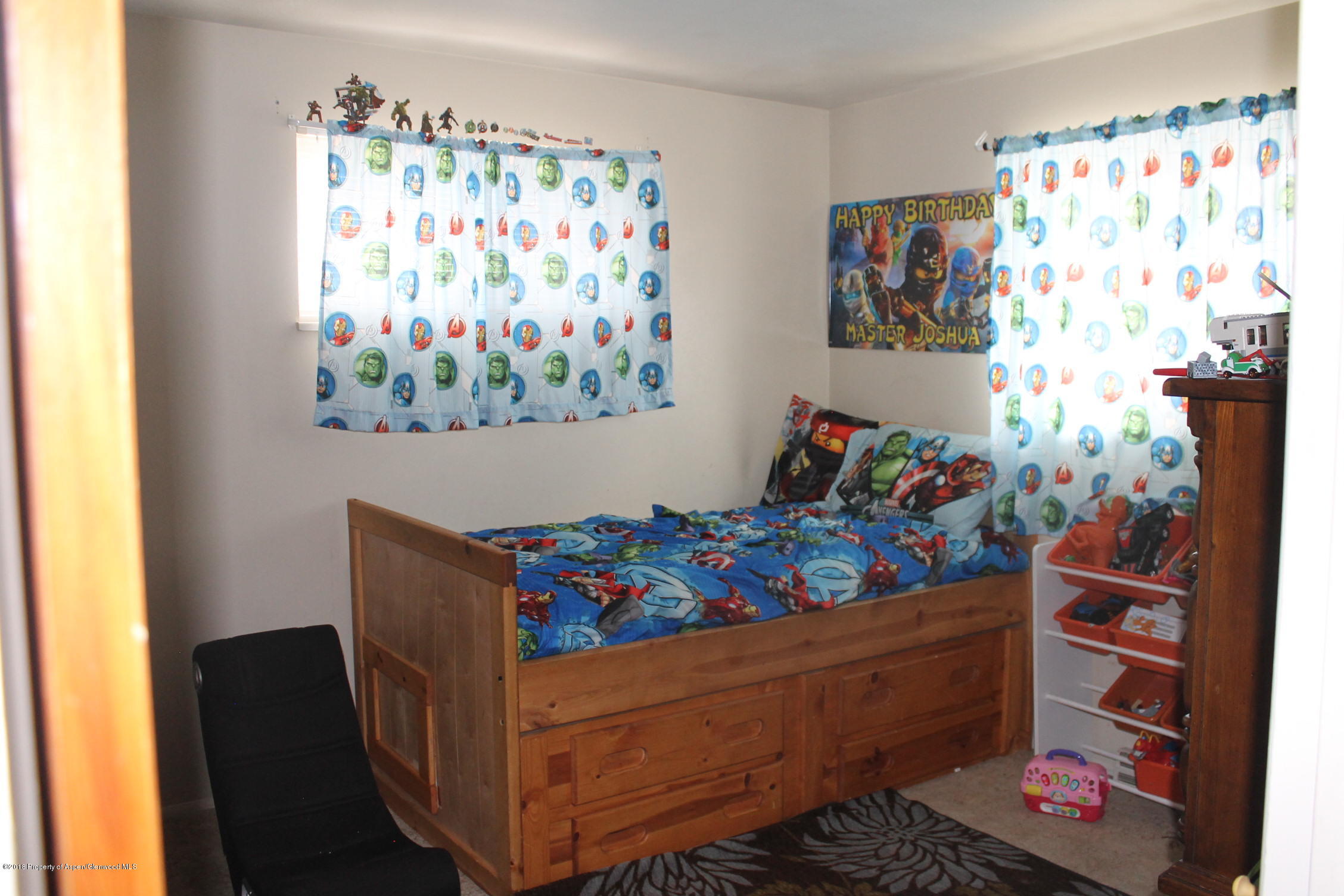 405 Ute Avenue Rifle, CO 81650 - Photo 6 of 21 a room with toys and wooden floor