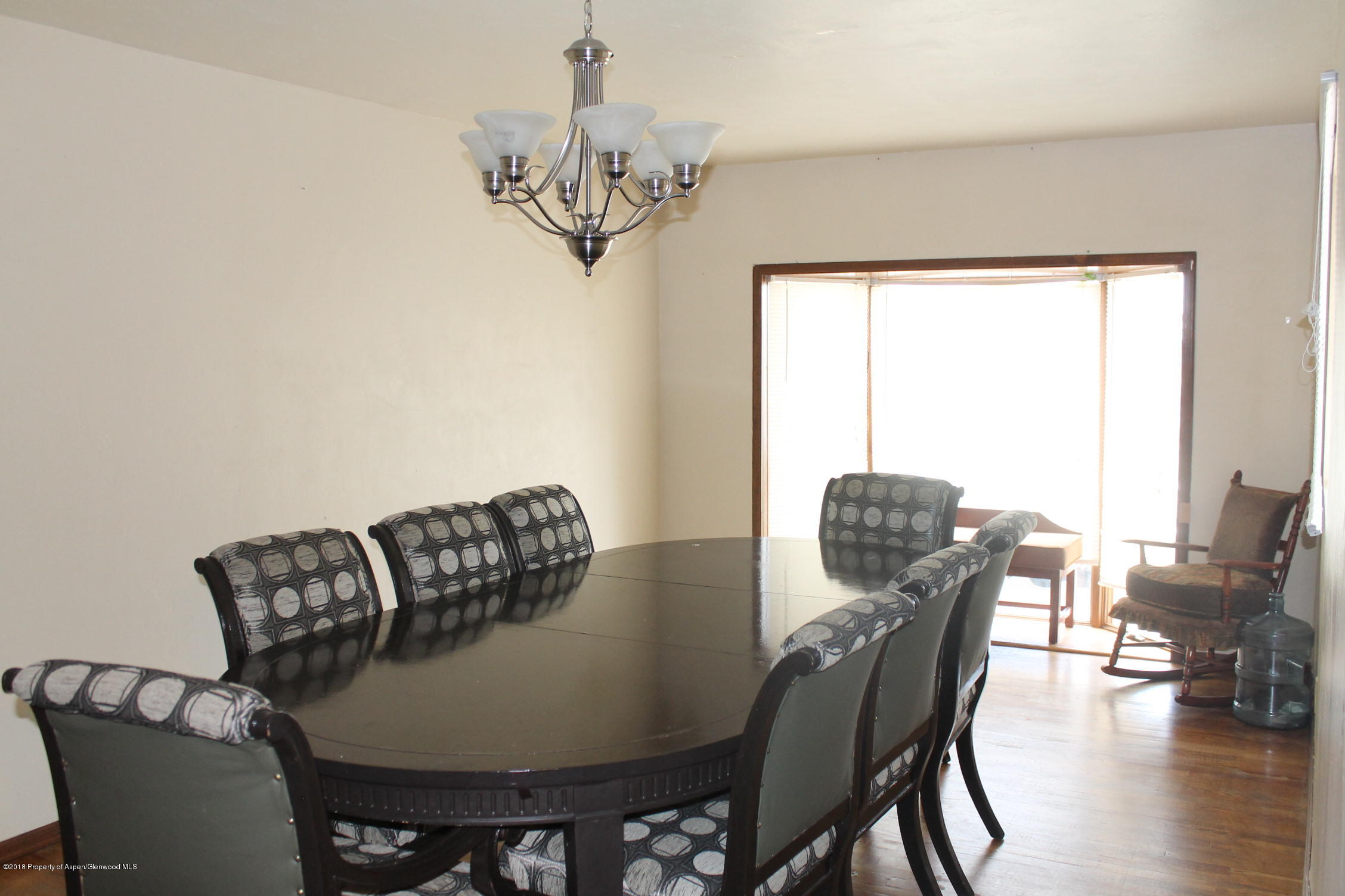 405 Ute Avenue Rifle, CO 81650 - Photo 9 of 21 a view of a dining room with furniture window and outside view